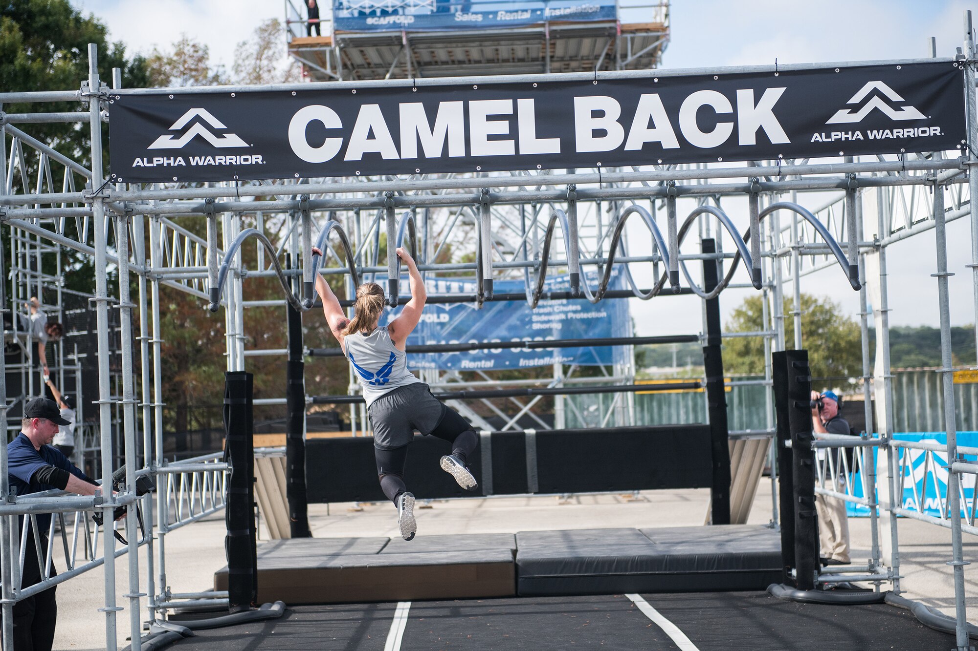 Staff Sgt. Tiffanie Sawatzke takes on the camel back obstacle during the 2019 Air Force Alpha Warrior Final Battle at Retama Park, Selma, Texas, Sept. 12, 2019. Air Force, Army and Navy military athletes competed against each other to determine the top three men and three women for each service. Those athletes make up the service teams that will go against each other during the 2019 Inter-Service Battle Sept. 14 at Retama. The Air Force partnered with Alpha Warrior three years ago to deliver functional fitness training to Airmen and their families. (U.S. Air Force photo by Sarayuth Pinthong)