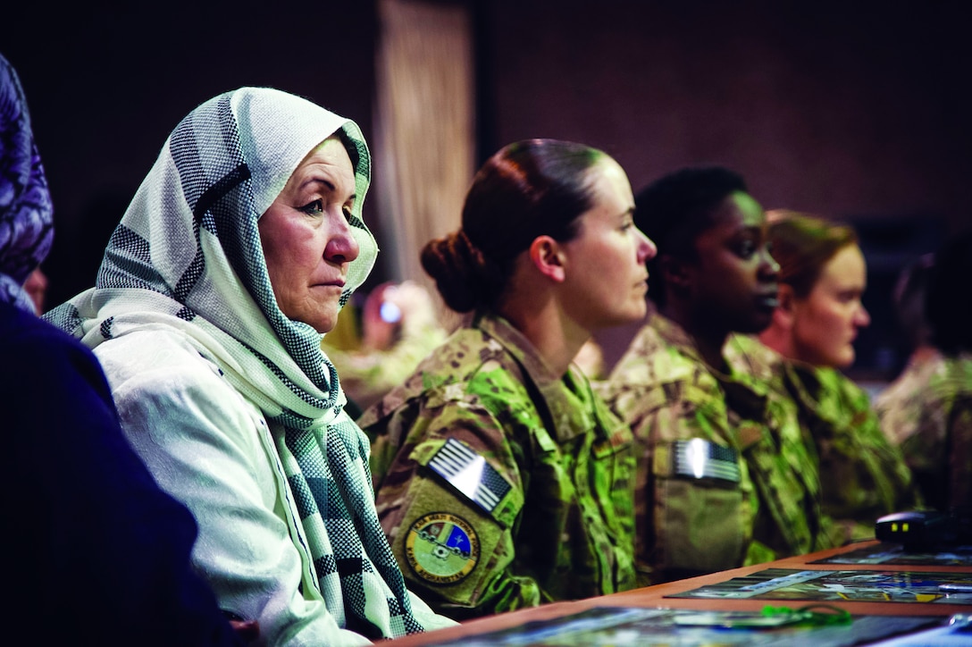 Women from the Afghan Air Force and International Security Assistance Force Afghanistan listen to presentations made during an International Women????????s Day celebration at Kabul International Airport March 7, 2013. The celebration highlighted the contributions afghan women make towards building a better and stronger Afghan Air Force. (U.S. Air Force Photo By: SSgt Dustin Payne, ISAF HQ Public Affairs)