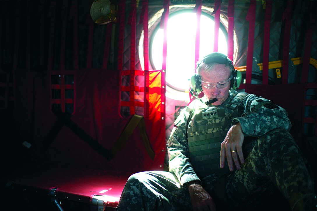 Army Gen. Martin E. Dempsey, chairman of the Joint Chiefs of Staff, aboard a CH-47 traveling from Bagram to Kabul, Afghanistan, for meeting with ISAF, CENTCOM, State Dept. and Afghanistan military leadership Aug. 20, 2012. DOD photo by D. Myles Cullen