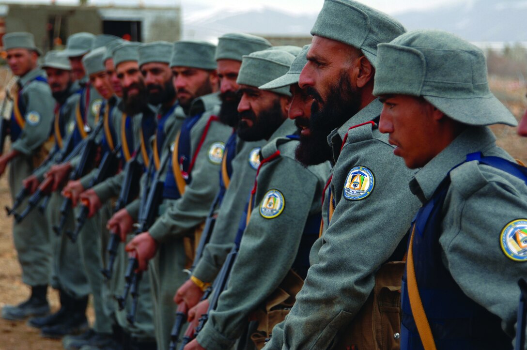 Afghanistan National Police (ANP) recruits listen to instructors before firing their AK-47 rifles at a range near the regional training center for the ANP near Gardez, Afghanistan, March 17, 2007. (U.S. Army photo by Staff Sgt. Michael Bracken) (Released)