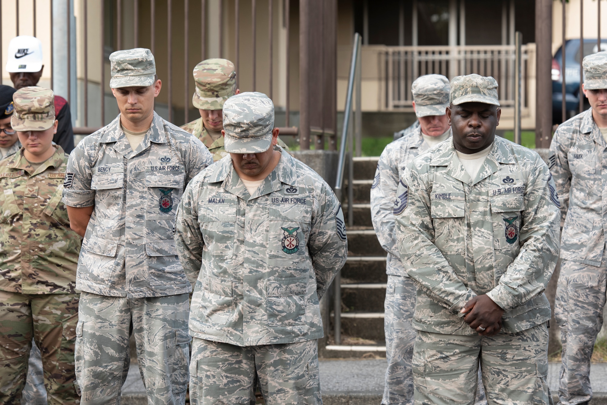 Airmen bow their heads in prayer during the 9/11 Tower Run, Sept. 11, 2019 at Yokota Air Base, Japan.