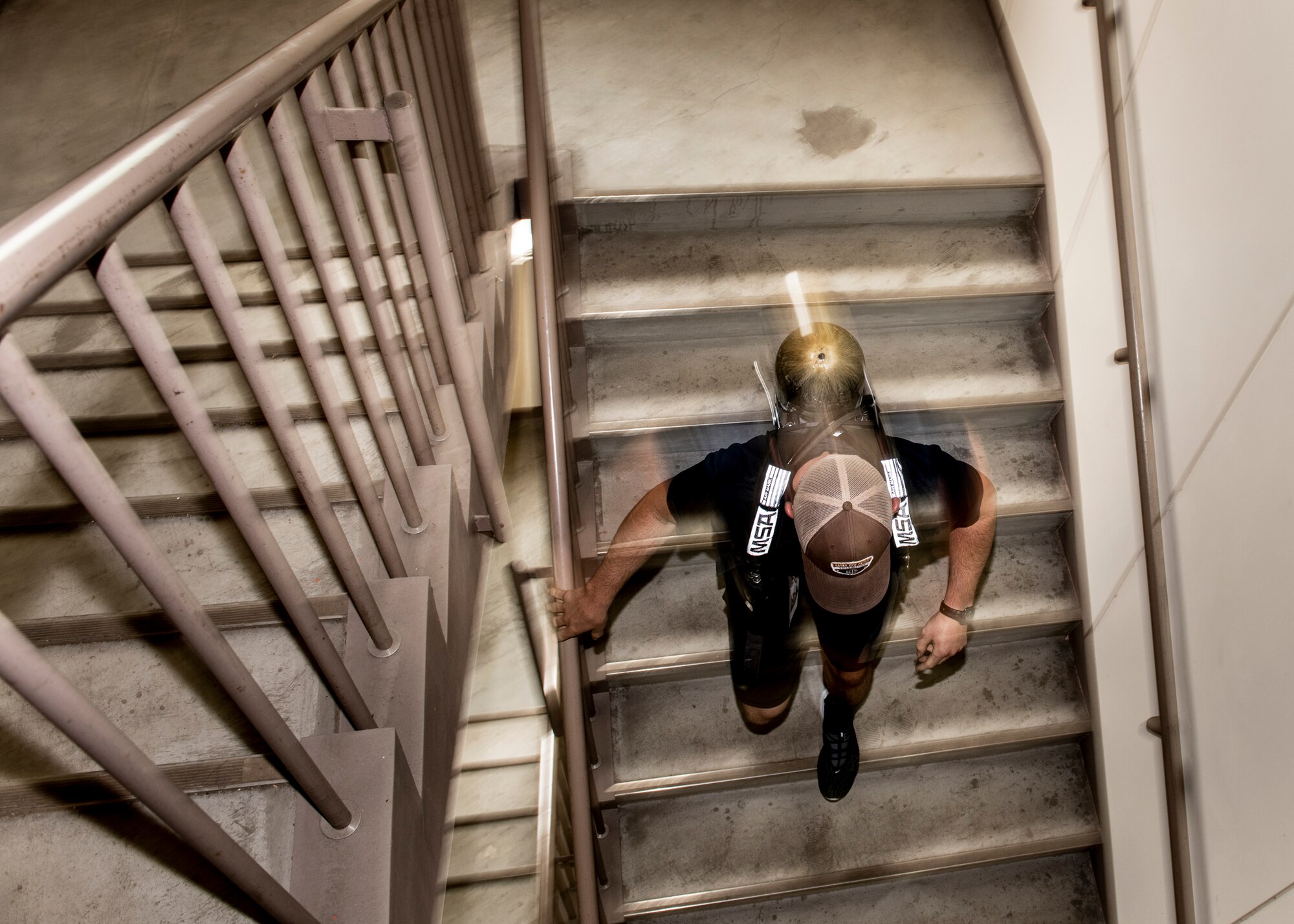 A tower run participant runs down a tower during the 9/11 Tower Run, Sept. 11, 2019 at Yokota Air Base, Japan.