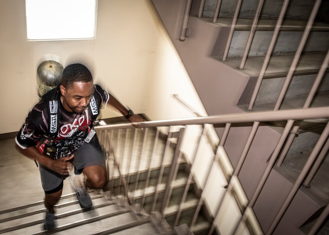 Master Sgt. Mario Rainge, 374th Communications Squadron first sergeant, runs up a flight of stairs during the 9/11 Tower Run, Sept. 11, 2019 at Yokota Air Base, Japan.