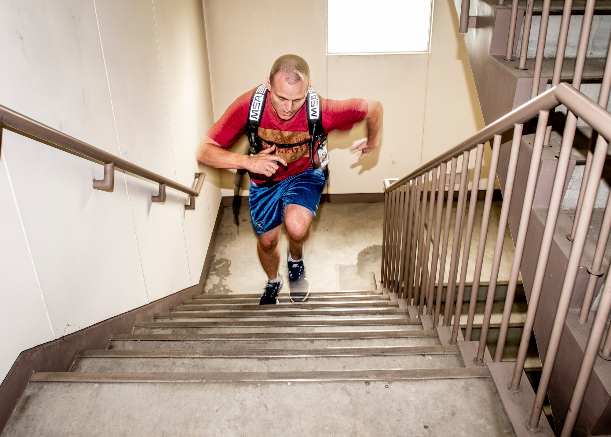 Master Sgt. Arthur Scruggs, 374th Operations Support Squadron 1st sergeant, runs up a flight of stairs during the 9/11 Tower Run, Sept. 11, 2019 at Yokota Air Base, Japan.