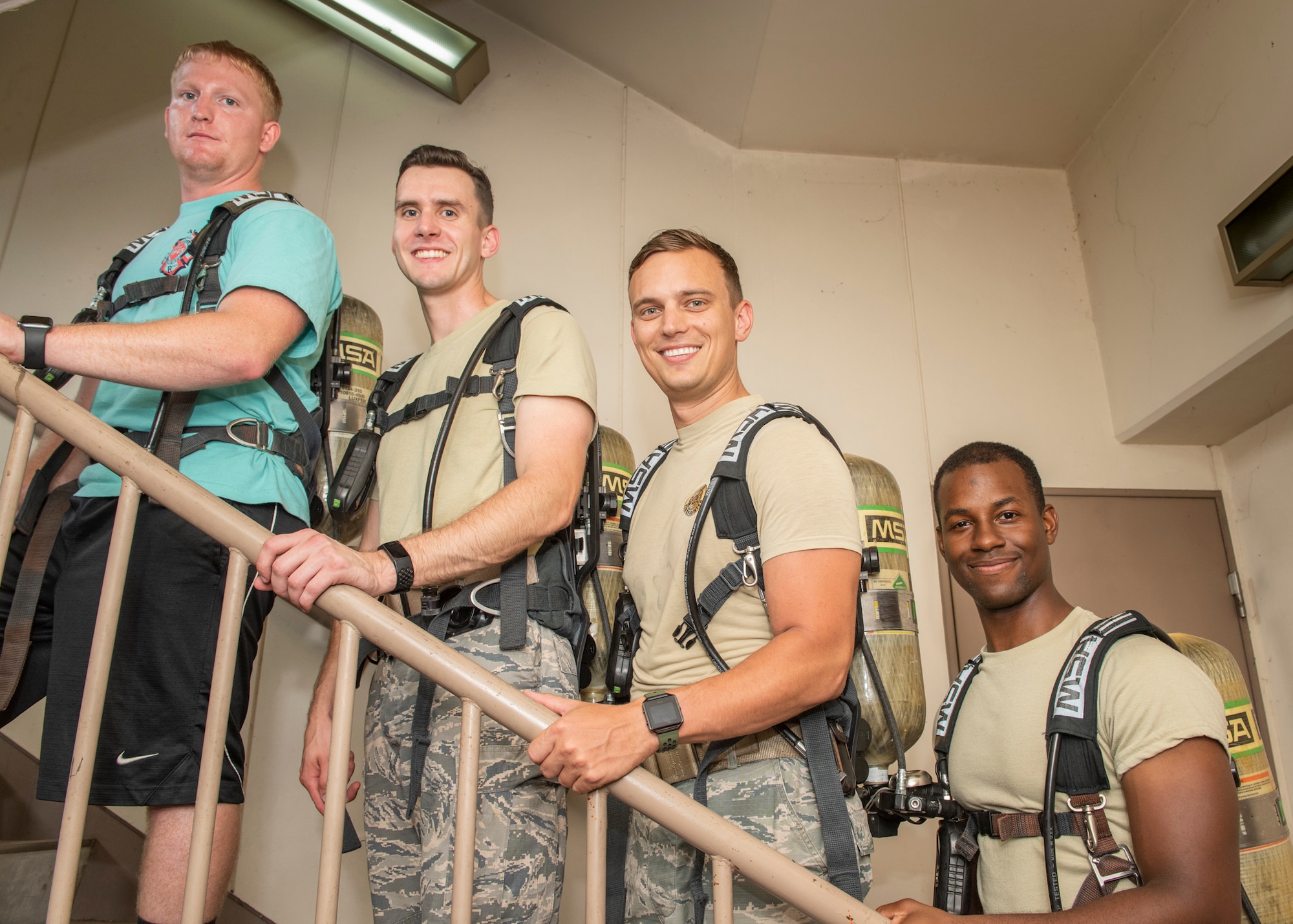 Team members from the 374th Civil Engineer Squadron fire and emergency services flight pose for a photo before their run during the 9/11 Tower Run, Sept. 11, 2019 at Yokota Air Base, Japan.