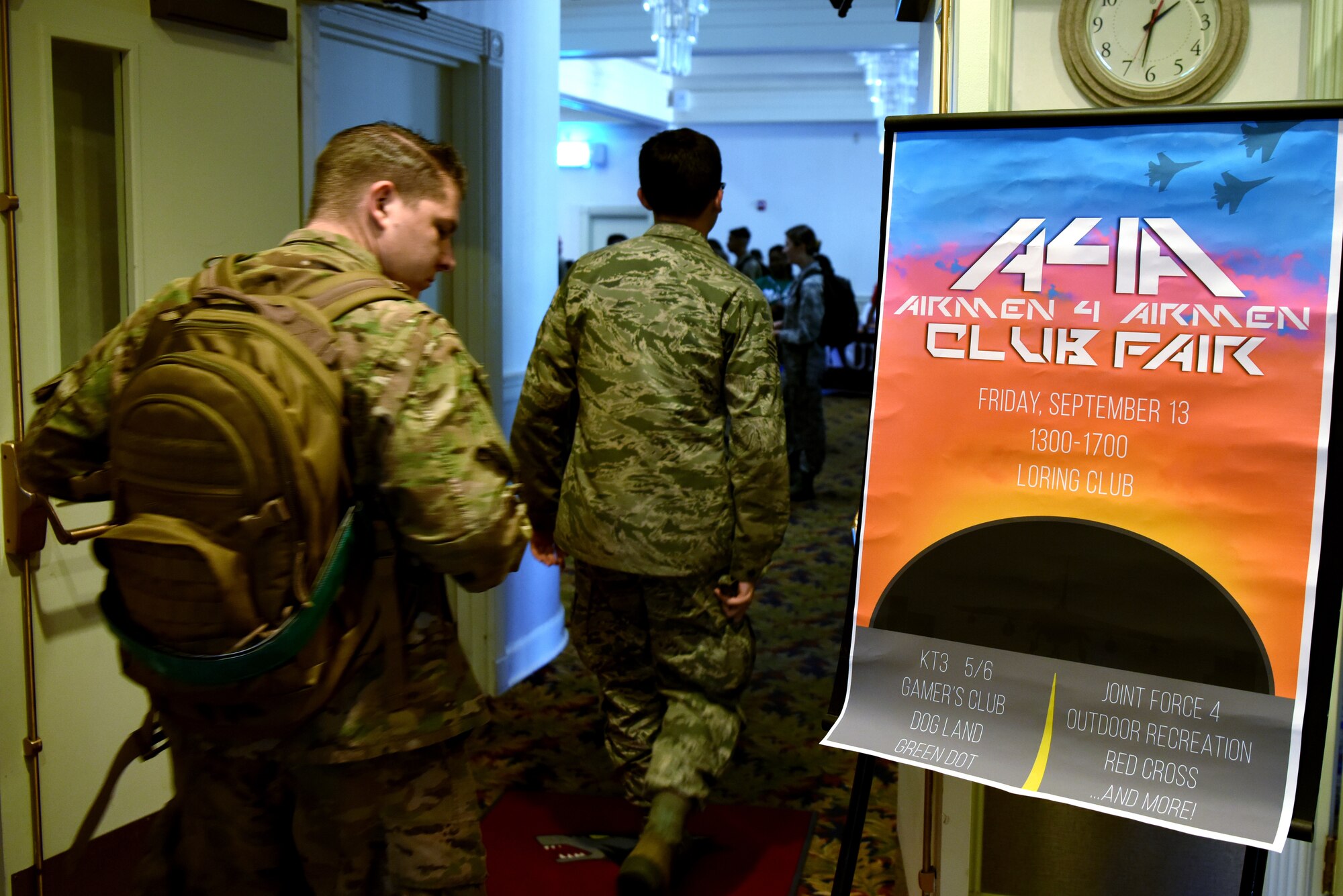 Airmen check out the flyer for the Airmen 4 Airmen Club Fair during the Resilience Tactical Pause capstone event at Kunsan Air Base, Republic of Korea, Sept. 13, 2019. The event featured over 20 different professional and social clubs from around the base. (U.S. Air Force photo by Staff Sgt. Joshua Edwards)