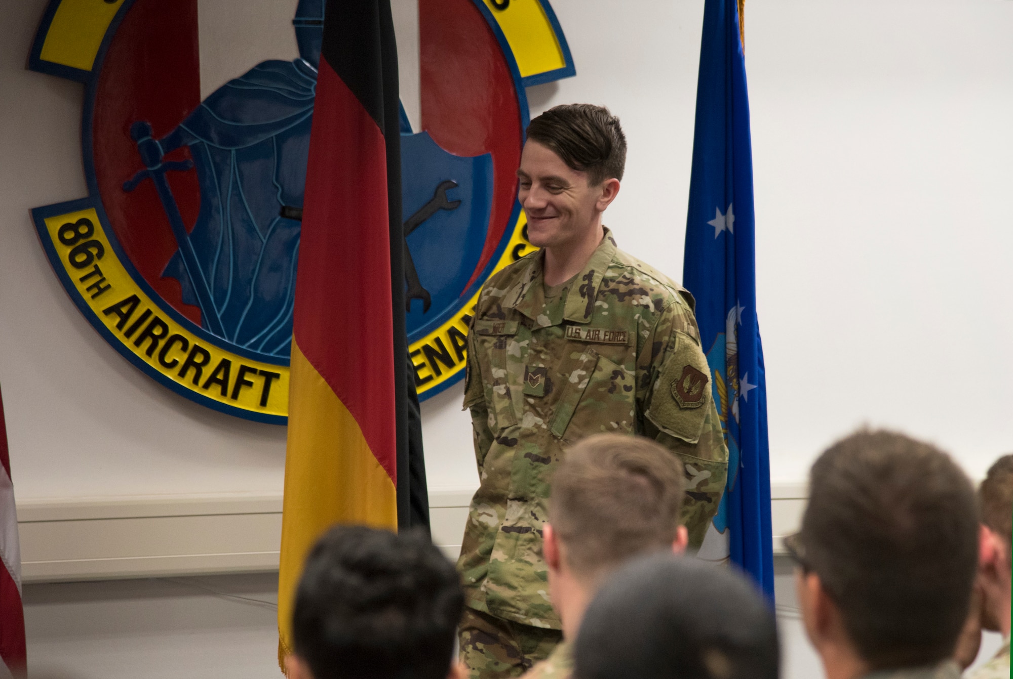 U.S. Air Force Staff Sgt. Spencer Koepp, a C-130 aircraft maintenance craftsman with the 86th Maintenance Squadron, stands in front of his squadron as he’s recognized as the Airlifter of the Week at Ramstein Air Base, Germany, Sept. 12, 2019.