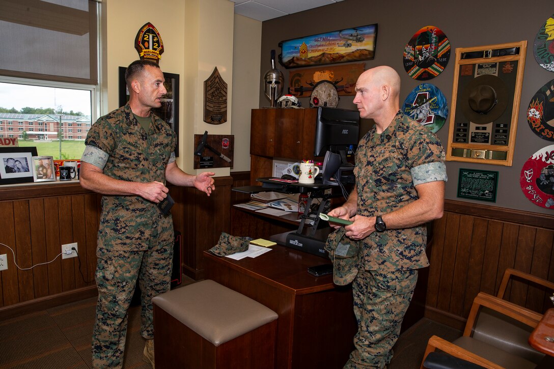 U.S. Marine Corps Sgt. Maj. Troy E. Black, the 19th Sergeant Major of the Marine Corps, talks with Sgt. Maj. Christopher Adams, the sergeant major of the Marine Corps Security Forces Regiment, during a visit to see Marines aboard Naval Weapons Station Yorktown, Virginia, Sept. 9, 2019. Black talked with Marines and Sailors at various all hands professional military education briefs in the local area. (U.S. Marine Corps photo by Sgt. Kelly L. Timney)