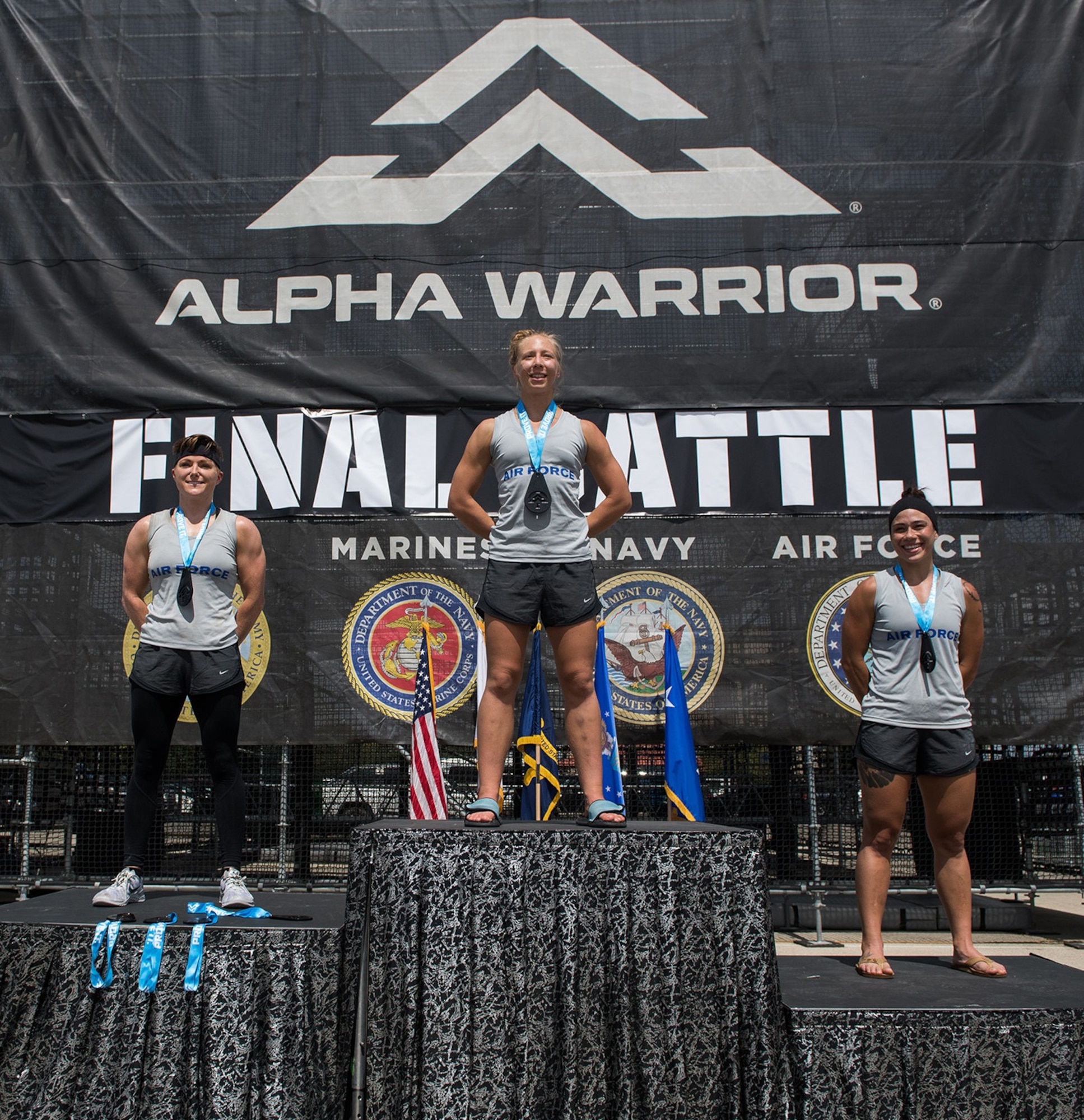 (From left) 2nd Lt. Michelle Strickland (second place), 14th Student Squadron, Columbus Air Force Base, Mississippi; 2nd Lt. Arielle Miller (first place), 412th Operational Medical Readiness Squadron bioenvironmental engineering readiness officer, Edwards Air Force Base, California; and 2nd Lt. Mary Caitlin Dominguez (third place), 633rd Inpatient Squadron clinical nurse, Langley Air Force Base, Virginia, pose for a photo after winning the 2019 Air Force Alpha Warrior Final Battle Sept. 12, 2019, at the Alpha Warrior Proving Ground, Retama Park, Selma, Texas. The Air Force partnered with Alpha Warrior three years ago to deliver functional fitness training to Airmen and their families.