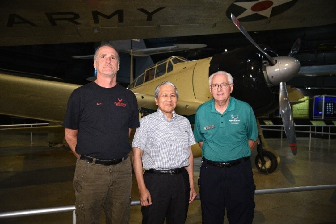 Left to right, David Lazzarine, Dr. Asai, and Roger Deere pose in front of the remodeled Zero.(U.S. Air Force photo/Ken LaRock)