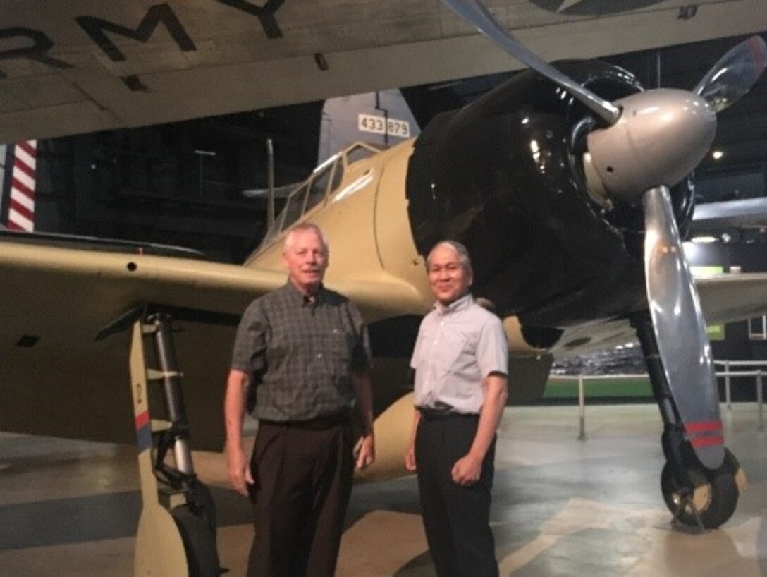 Left to right, Gary Dale, technology lead, Rapid Global Mobility, Aerospace Systems Directorate, Air Force Research Laboratory, and Dr. Asai, and pose in front of the remodeled Zero.(Courtesy photo)