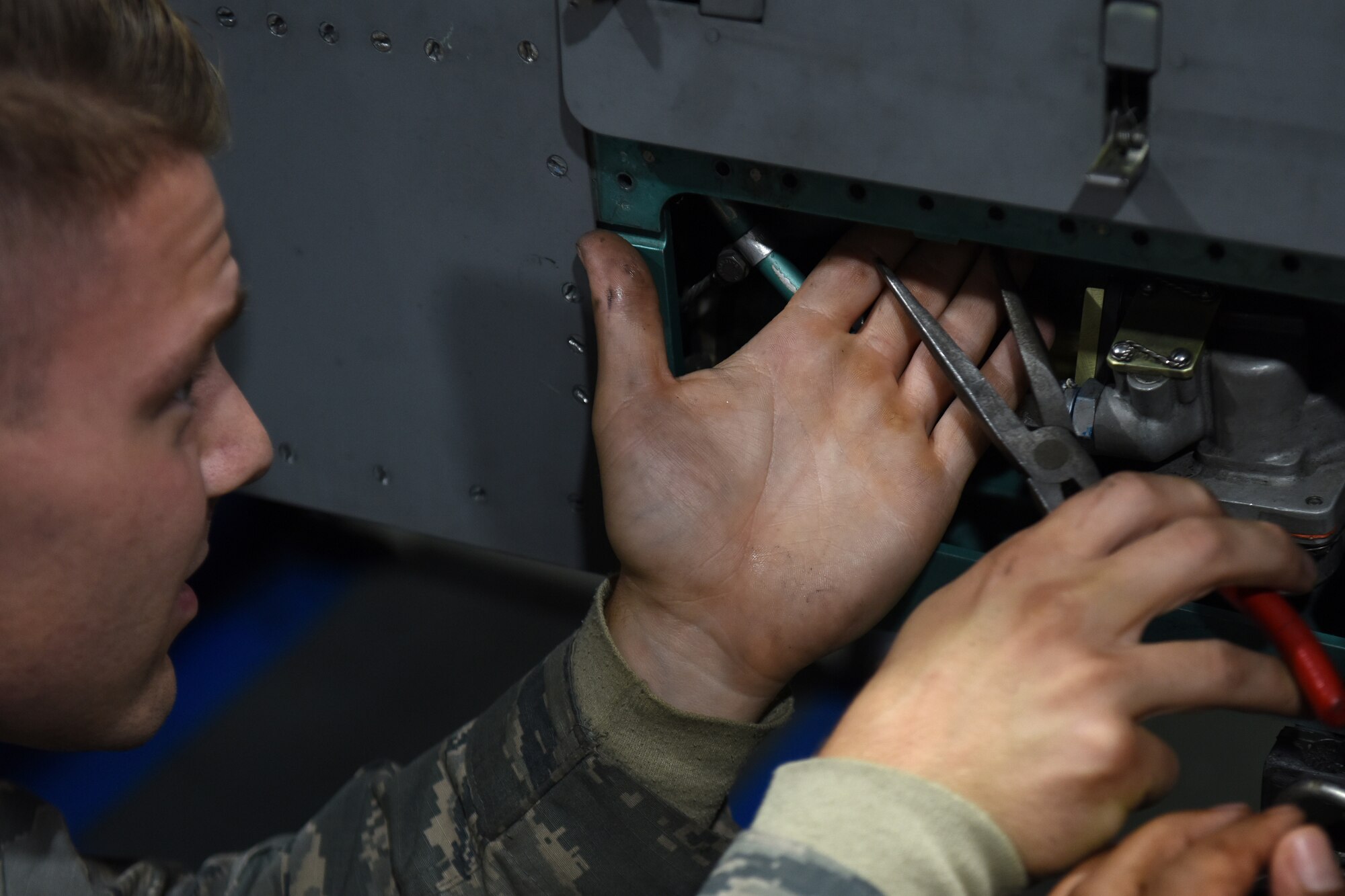 An armament maintenance technician from the 48th Munitions Squadron works on a pylon at Royal Air Force Lakenheath, England, Sept. 11, 2019. The Armament flight’s main focus is to support the flightline operations, either by having equipment ready or standing by for flightline responses. (U.S. Air Force photo by Airman 1st Class Madeline Herzog)