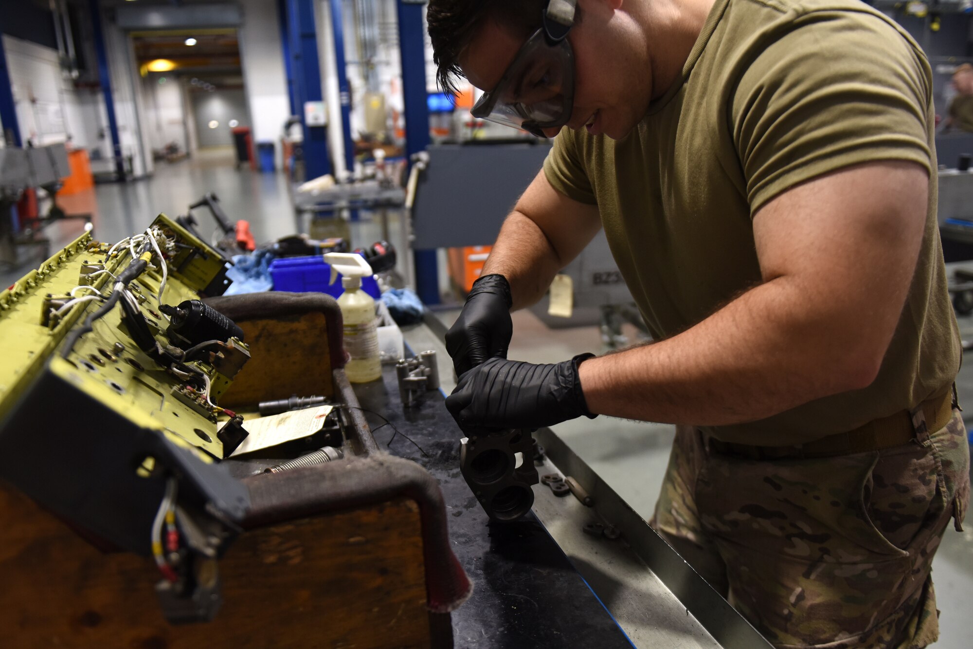 An armament maintenance technician from the 48th Munitions Squadron cleans and inspects a breech assembly of a BRU-47 bomb rack at Royal Air Force Lakenheath, England, Sept. 11, 2019. Armament Flight’s main focus is to support the flightline operations, either by having equipment ready or standing by for flightline responses. (U.S. Air Force photo by Airman 1st Class Madeline Herzog)
