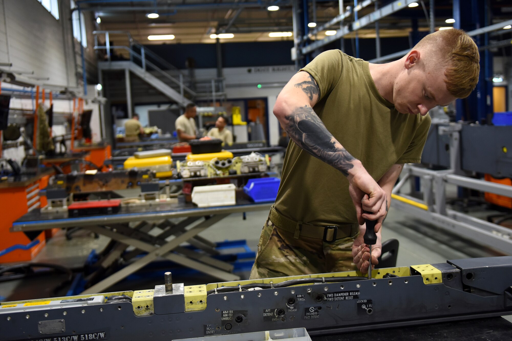 An armament maintenance technician from the 48th Munitions Squadron fixes part of a pylon at Royal Air Force Lakenheath, England, Sept. 11, 2019. The Armament flight works on all weapons-related equipment from both the 48th Fighter Wing F-15C Eagle and F-15E Strike Eagles. (U.S. Air Force photo by Airman 1st Class Madeline Herzog)
