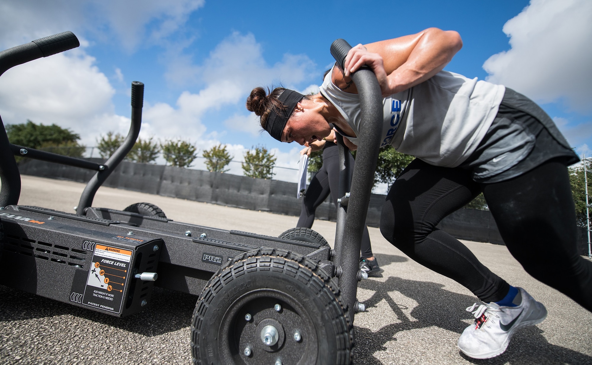 2nd Lt. MaryCaitlin Dominguez pushes a sled during the 2019 Air Force Alpha Warrior Final Battle at Retama Park, Selma, Texas, Sept. 12, 2019. Air Force, Army and Navy military athletes competed against each other to determine the top three men and three women for each service. Those athletes make up the service teams that will go against each other during the 2019 Inter-Service Battle Sept. 14 at Retama. The Air Force partnered with Alpha Warrior three years ago to deliver functional fitness training to Airmen and their families.