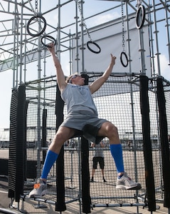 Capt. Noah Palicia attacks the rings on the Alpha Warrior Proving Ground , Selma, Texas, Sept. 9, 2019 during the Air Force Alpha Warrior Final Battle. The annual competition crowns the Air Force's top Alpha Warriors with the top three men and three women forming the Air Force Alpha Warrior Team. The Air Force partnered with Alpha Warrior three years ago to deliver functional fitness training to Airmen and their families.