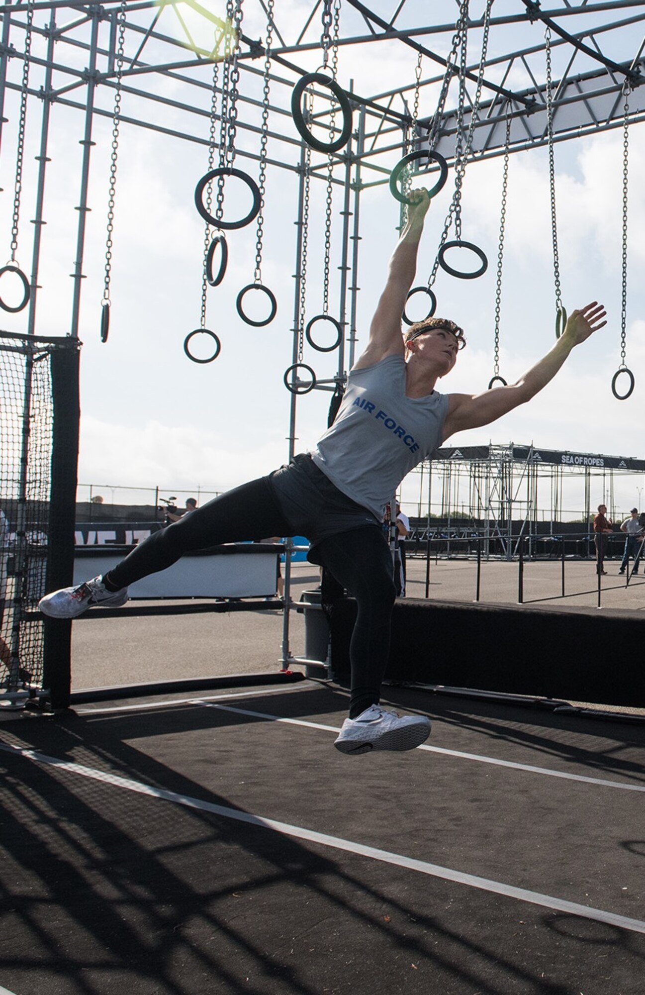 2nd Lt. Michelle Strickland takes to the rings during the 2019 Air Force Alpha Warrior Final Battle at Retama Park, Selma, Texas, Sept. 12, 2019. Air Force, Army and Navy military athletes competed against each other to determine the top three men and three women for each service. Those athletes make up the service teams that will go against each other during the 2019 Inter-Service Battle Sept. 14 at Retama. The Air Force partnered with Alpha Warrior three years ago to deliver functional fitness training to Airmen and their families.