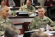 Army Materiel Command Commander, Gen. Gus Perna, receives an update from U.S. Army Aviation and Missile Command Commander, Maj. Gen. Todd Royar during a routine quarterly briefing at AMCOM headquarters on Sept. 10, 2019.