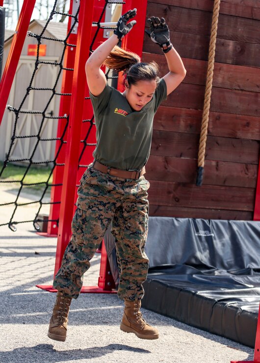 Capt. Stefanie Allen, Marine Corps Base Quantico, Va., executes burpees during the 4th challenge of the 5th annual 2019 High Intensity Tactical Training Championship at Butler Stadium, Marine Corps Base Quantico Va., Sept. 10, 2019. The 4th challenge consisted of more than 600 yards of various sprints, crawls, tire flips, sled drags, and farmers carries. The HITT Championship tests Marines athleticism and combat readiness by competing in various physical events testing strength, speed, agility and power.