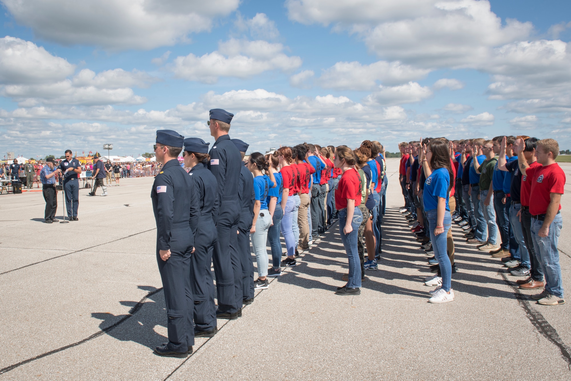 1st Lt. Robert Tobey, an Army World War II veteran, gives the oath of enlistment to 75 Airmen, Soldiers, Marines and Coast Guard at a joint enlistment ceremony during the Grissom Air & Space Expo at Grissom Air Reserve Base, Indiana, Sept. 7, 2019. Tobey, a B-17s Flying Fortress pilot, participated in multiple missions throughout WWII, flying his final mission on April 26, 1945. (U.S. Air Force photo/Master Sgt. Benjamin Mota)