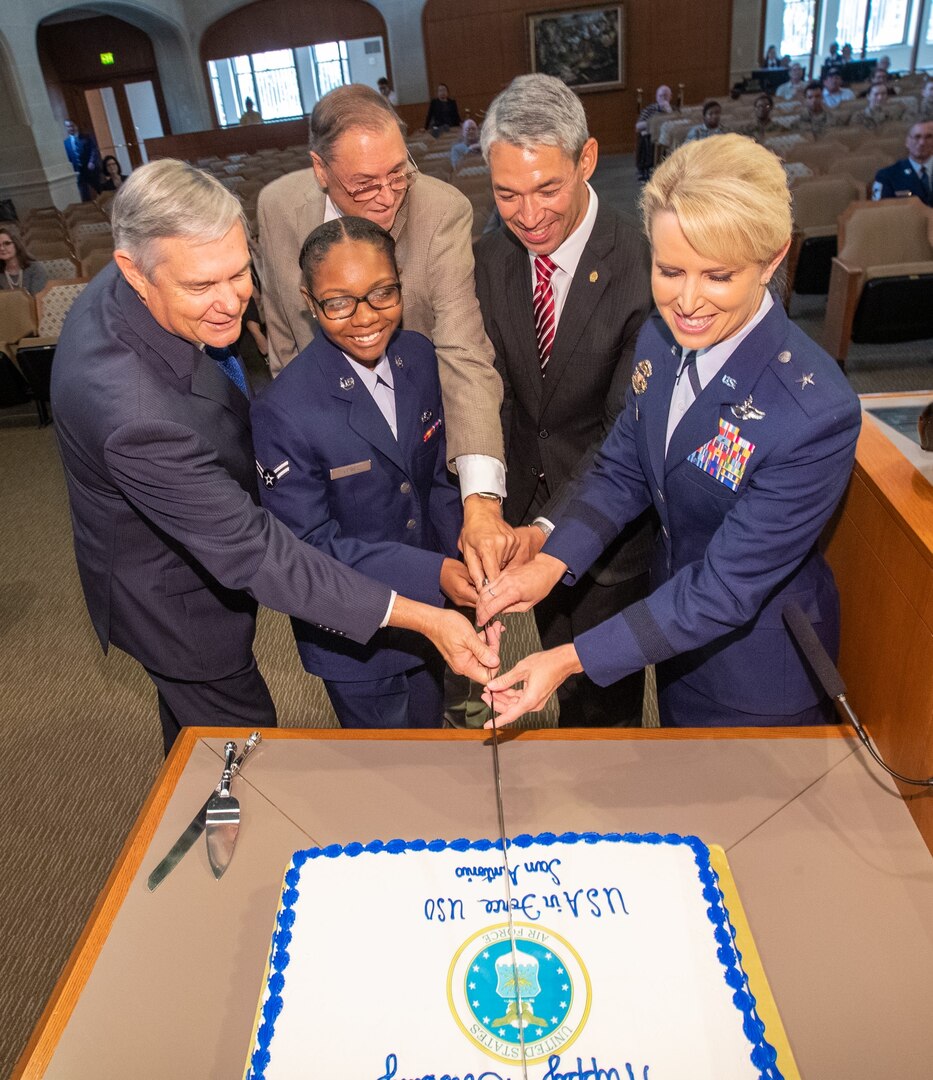 (From left) As is the Air Force birthday tradition, District 10 Councilman Clayton Perry, who served as the oldest Airman, Airman 1st Class Charzell Lewis served as the youngest Airman with the assistance of District 9 Councilman John Courage,  San Antonio Mayor Ron Nirenberg and Brig. Gen. Laura Lenderman, 502nd Air Base Wing and Joint Base San Antonio commander.