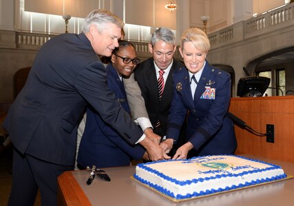 (From left) As is the Air Force birthday tradition, District 10 Councilman Clayton Perry, who served as the oldest Airman, Airman 1st Class Charzell Lewis served as the youngest Airman with the assistance of District 9 Councilman John Courage,  San Antonio Mayor Ron Nirenberg and Brig. Gen. Laura Lenderman, 502nd Air Base Wing and Joint Base San Antonio commander.