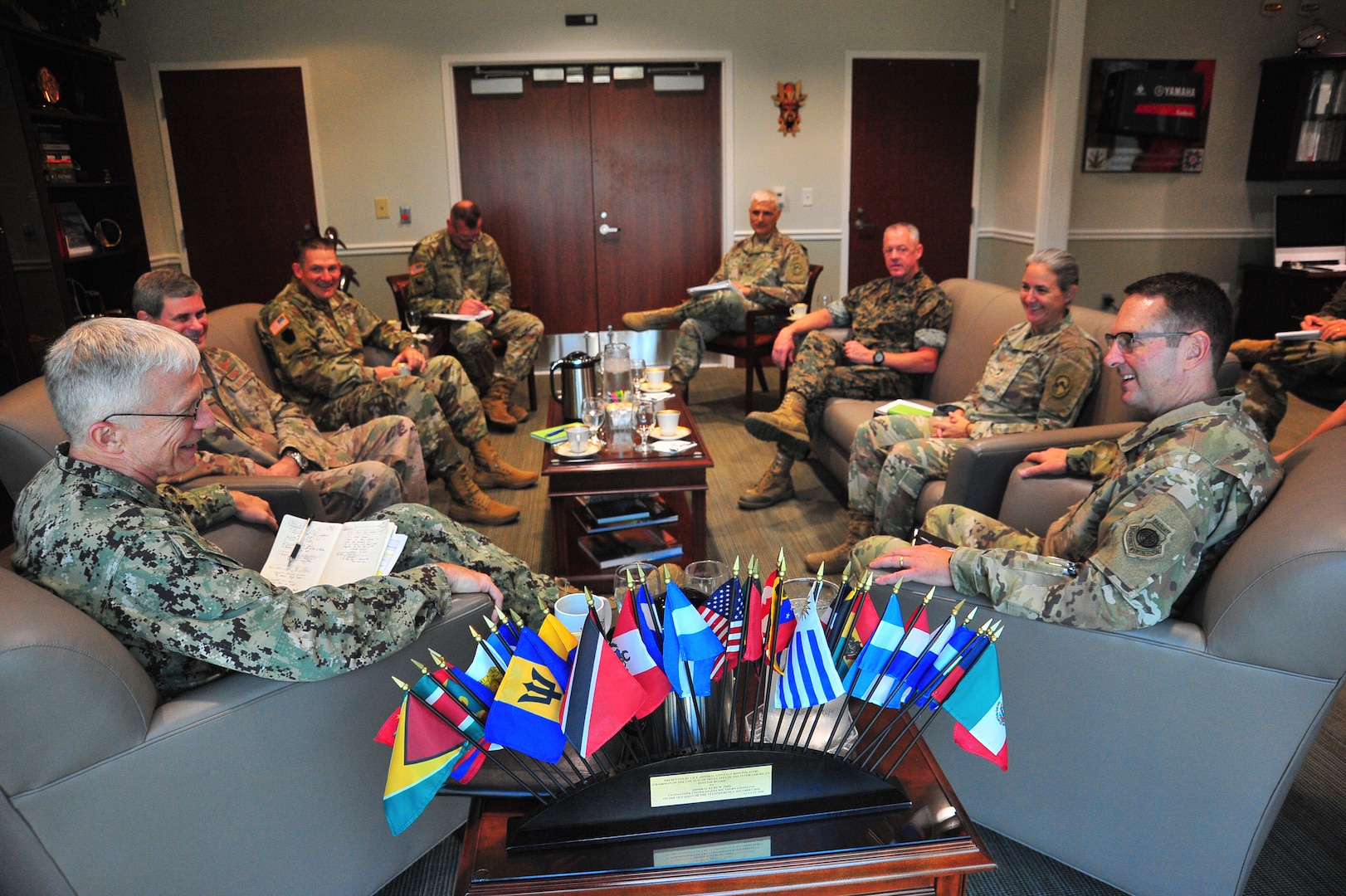 A group of military leaders meet.