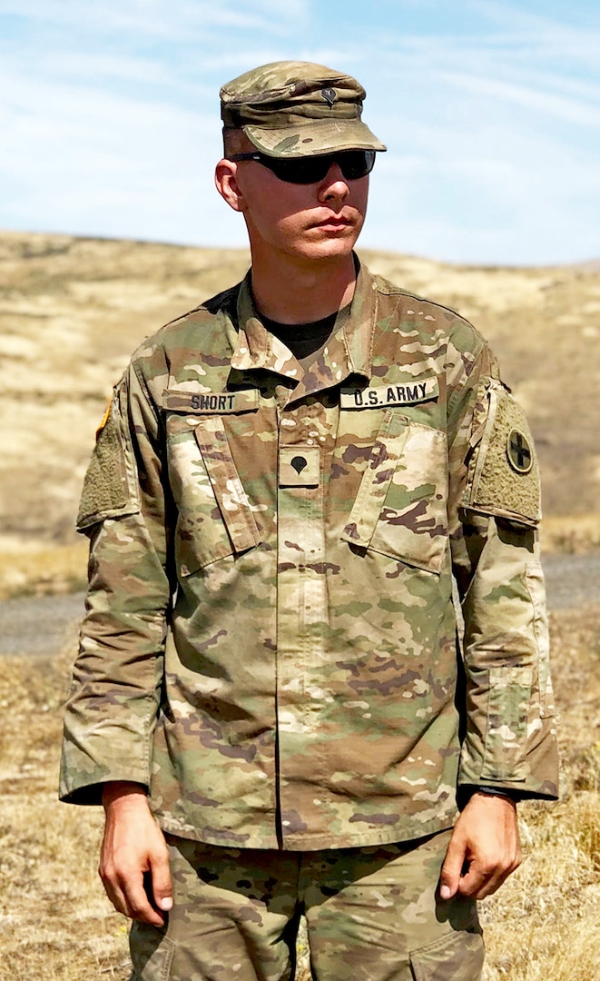 Spc. James Tyler Short, a combat medic with the Headquarters and Headquarters Company, 2nd Battalion, 130th Infantry Regiment, Illinois Army National Guard, surveys the digital multipurpose range complex during Rising Thunder 19 at Yakima Training Center, Yakima, Washington