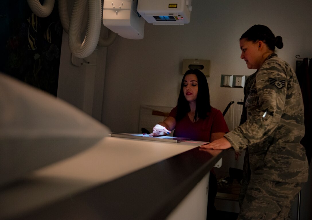 Brook Hutson, 82nd Medical Support Squadron registered diagnostic medical sonographer, gets her hand x-rayed by Staff Sgt. Morgan Burkett, diagnostic imaging Phase II student, at Sheppard Air Force Base, Texas, Sept. 12, 2019. Diagnostic imaging students start their training at Fort Sam Houston, TX, and will be sent to other bases (i.e. Sheppard) and will complete their training there. Sheppard receives around five students every ten months. The students work in the lab during the day and have class in the afternoon. (U.S. Air Force photo by Airman 1st Class Pedro Tenorio)