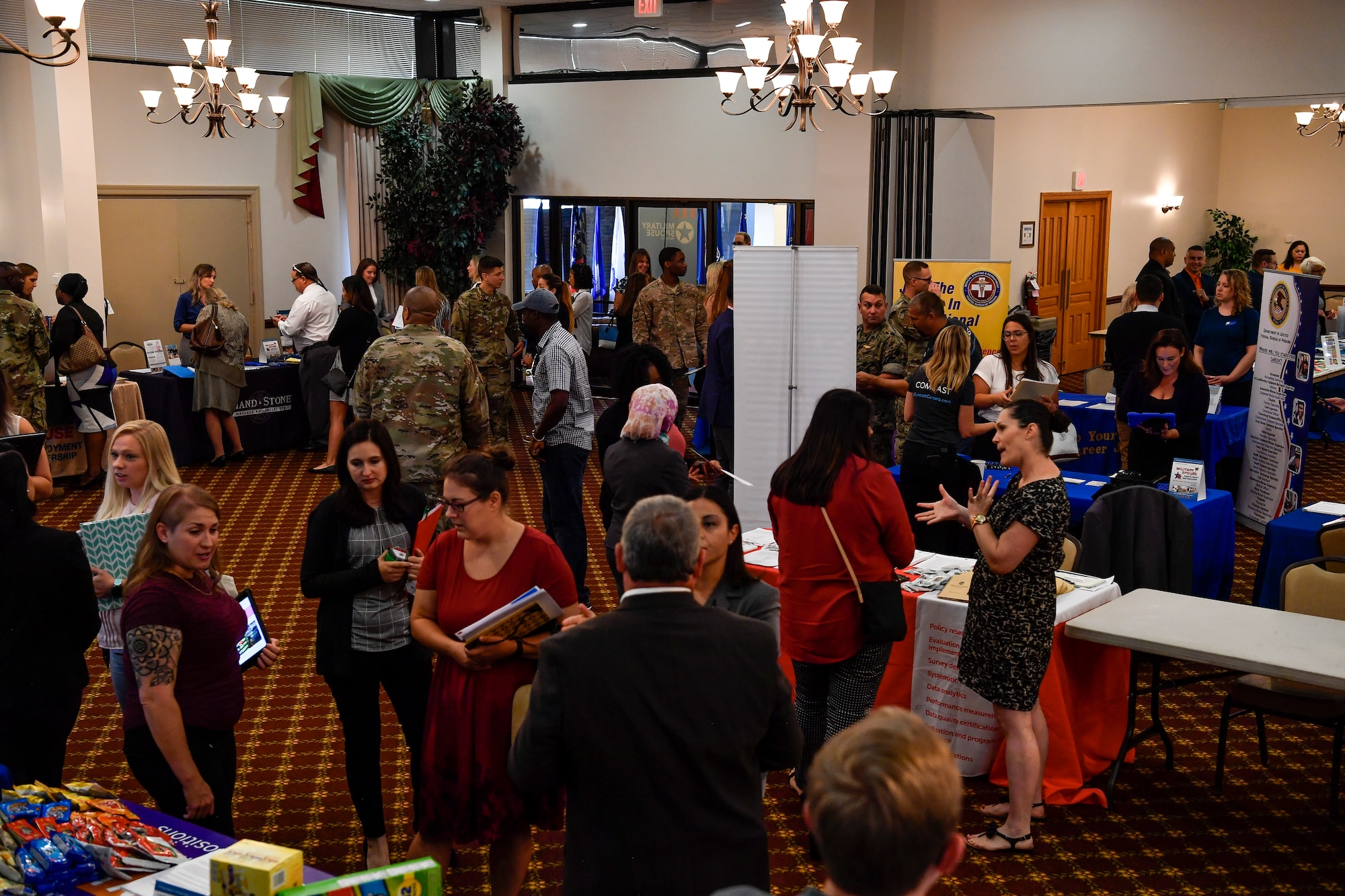 Patrons attending the Military Spouse Hiring Event interact with potential employers at Joint Base McGuire-Dix-Lakehurst, New Jersey, Sept. 12, 2019. During the event, more than 175 spouses received information on job opportunities, applied for employment and received professional headshots for their LinkedIn accounts. The event was hosted by Hiring our Heroes, a U.S. Chamber of Commerce Foundation.