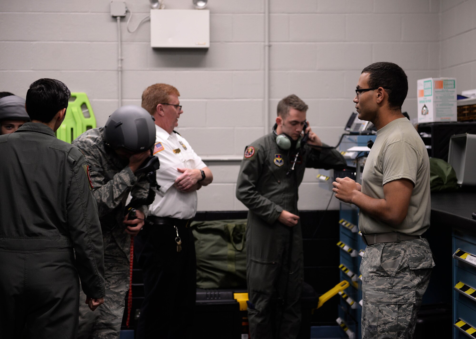 Airmen are escorted outside the Hyperbaric Chamber Room during a simulated chamber flight Sept. 3, 2019, on Columbus Air Force Base, Miss. A simulated fire began in the room, causing Airmen to immediately evacuate the building and Hyperbaric Chamber Room. (U.S. Air Force photo by Airman 1st Class Hannah Bean)