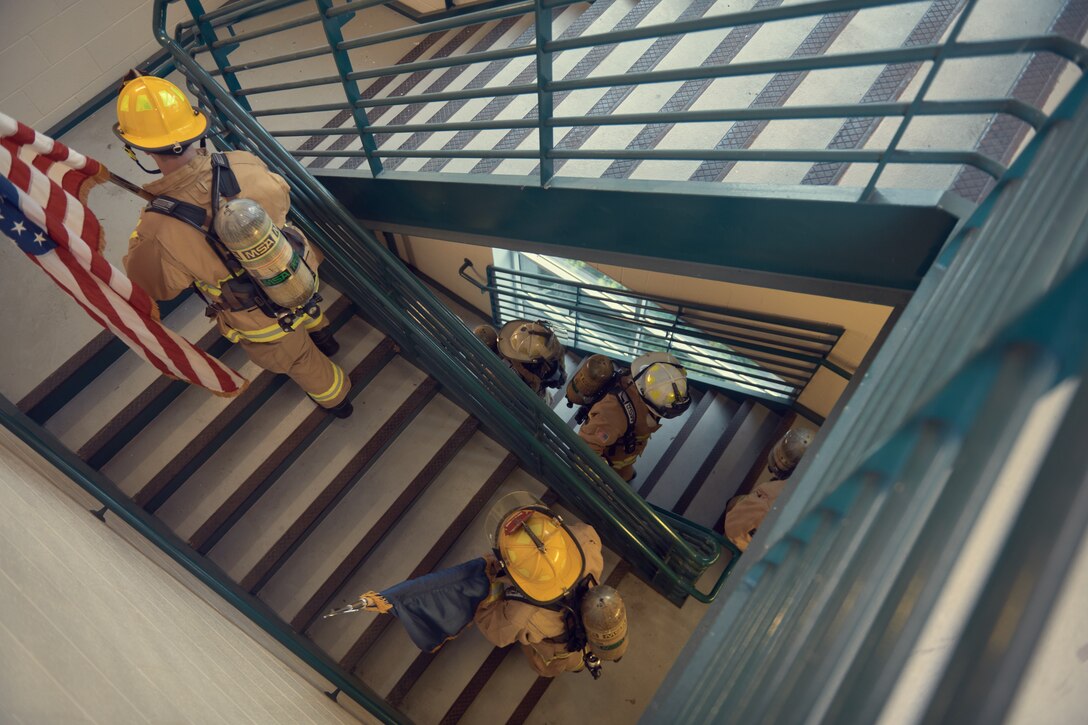 Firefighters mark the highest point firefighters reached in the twin towers on 9/11