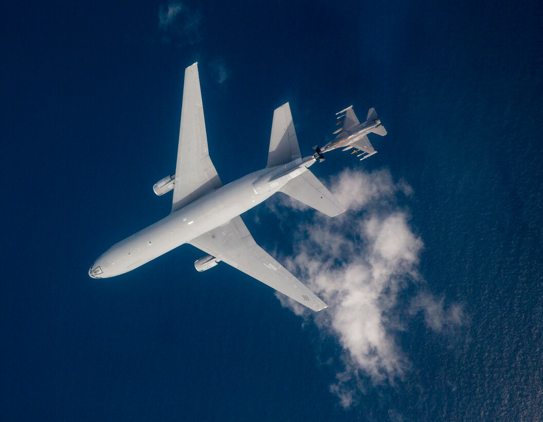 An F-16 from receives fuel from a KC-10 Extender