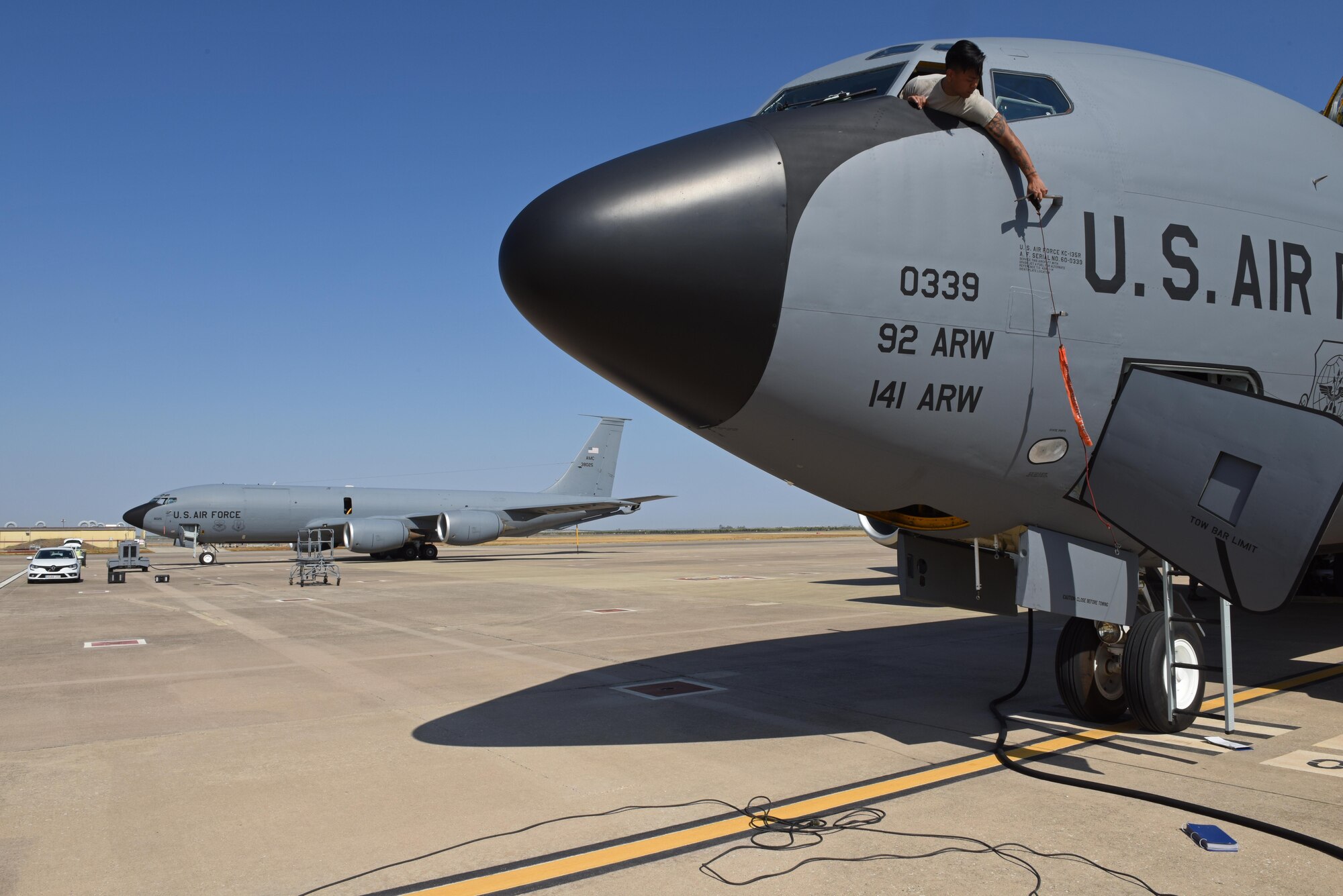U.S. Air Force Staff Sgt. Mico Arenas, 92nd Aircraft Maintenance Squadron crew chief, places a 'remove before flight' safety warning tag onto a KC-135 Stratotanker at Moron Air Base, Spain, Sept. 6, 2019. Various Airmen from the 92nd Maintenance Group are deployed in support of Operation Juniper Micron, a counterterrorism operation stemming from a long-standing relationship between the U.S. and French governments dating back to 2013. (U.S. Air Force photo by Staff Sgt. Nick J. Daniello)