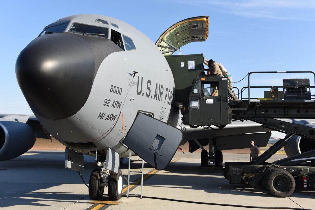 92nd Logistics Readiness Squadron Airmen load cargo onto a KC-135 Stratotanker at Fairchild Air Force Base, Washington, in preparation of supporting Operation Juniper Micron Sept. 2019.
