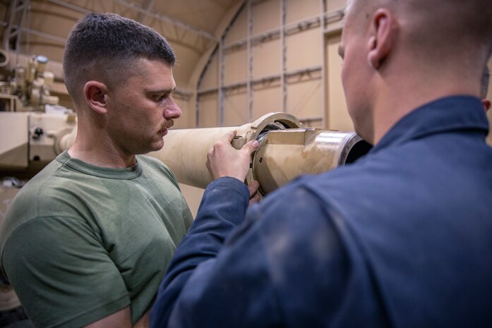 U.S. Marines check the main gun seals on a M1A1 Abrams tank at Camp Arifjan, Kuwait, July 13.