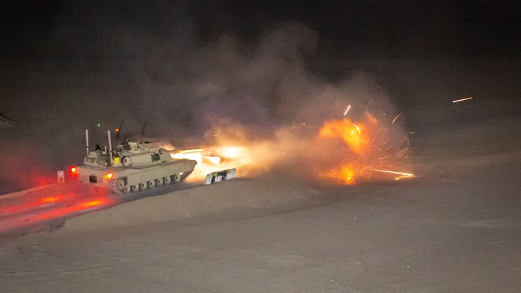 An M1A1 Abrams tank, attached to India Company, Battalion Landing Team 3/5, 11th Marine Expeditionary Unit, fires its main battle gun during a live-fire exercise. The Boxer Amphibious Ready Group and 11th MEU are deployed to the U.S. 5th Fleet area of operations in support of naval operations to ensure maritime stability and security in the Central Region, connecting the Mediterranean and the Pacific through the Western Indian Ocean and three strategic choke points.