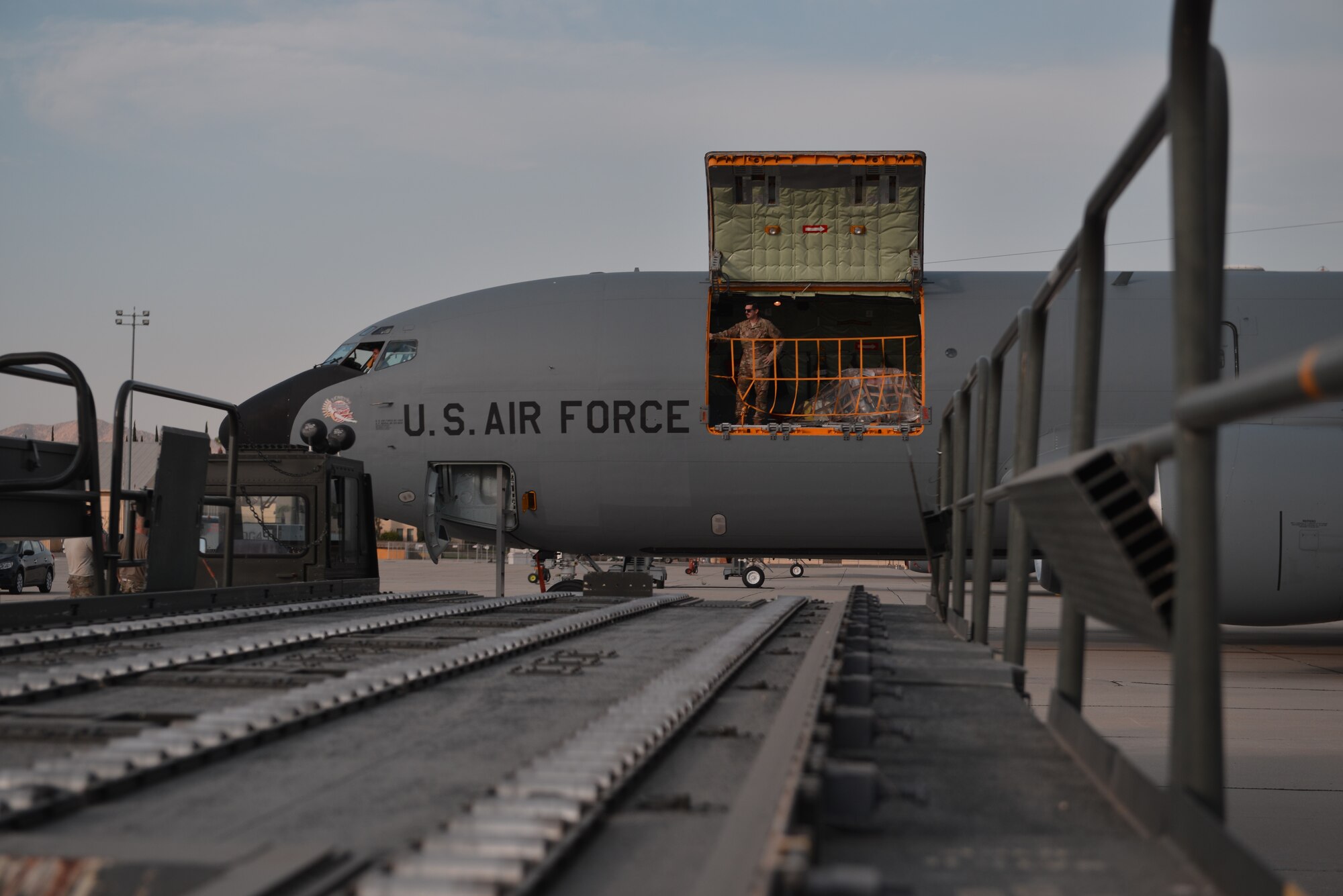 A KC-135 Stratotanker boom operator from Fairchild Air Force Base, Washington, prepares to unload cargo at March Air Reserve Base, California, Sept. 4, 2019. Fairchild Airmen will continue their Global Reach mission at March ARB during Air Mobility Command’s premier exercise Mobility Guardian 2019, currently hosted at Team Fairchild. (U.S. Air Force photo by Airman 1st Class Ryan Gomez)