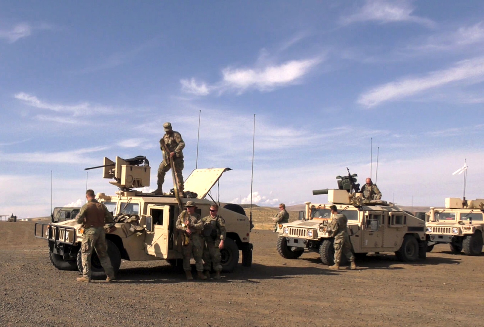 Troops from the Illinois National Guard prepare to depart on a live fire exercise during Rising Thunder 19.