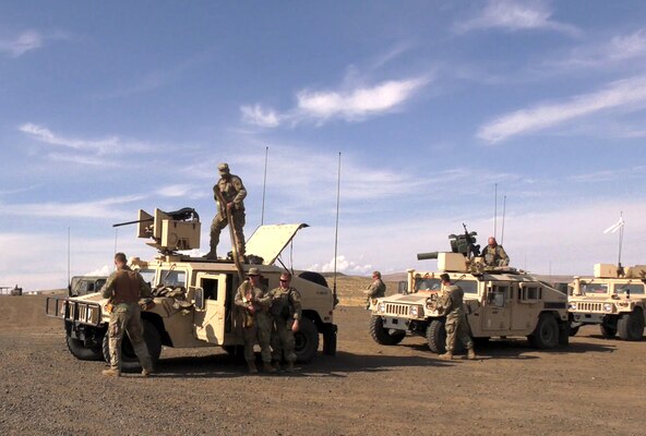 Troops from the Illinois National Guard prepare to depart on a live fire exercise during Rising Thunder 19.