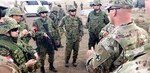 Capt. Jordan Legris, commander, Company D, 2nd Battalion, 130th Infantry Regiment, briefs members of the Japanese Ground Self-Defense Force prior to the kick-off of the live fire exercise during Rising Thunder 19.