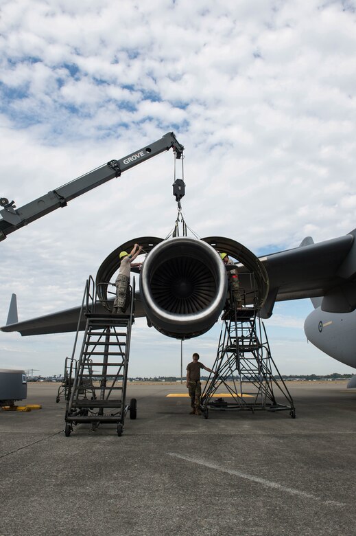 62nd Maintenance Squadron Airmen replace an engine ring cowl on a Royal Australian Air Force C-17 Globemaster III at Joint Base Lewis-McChord, Wash., Sept. 5, 2019.