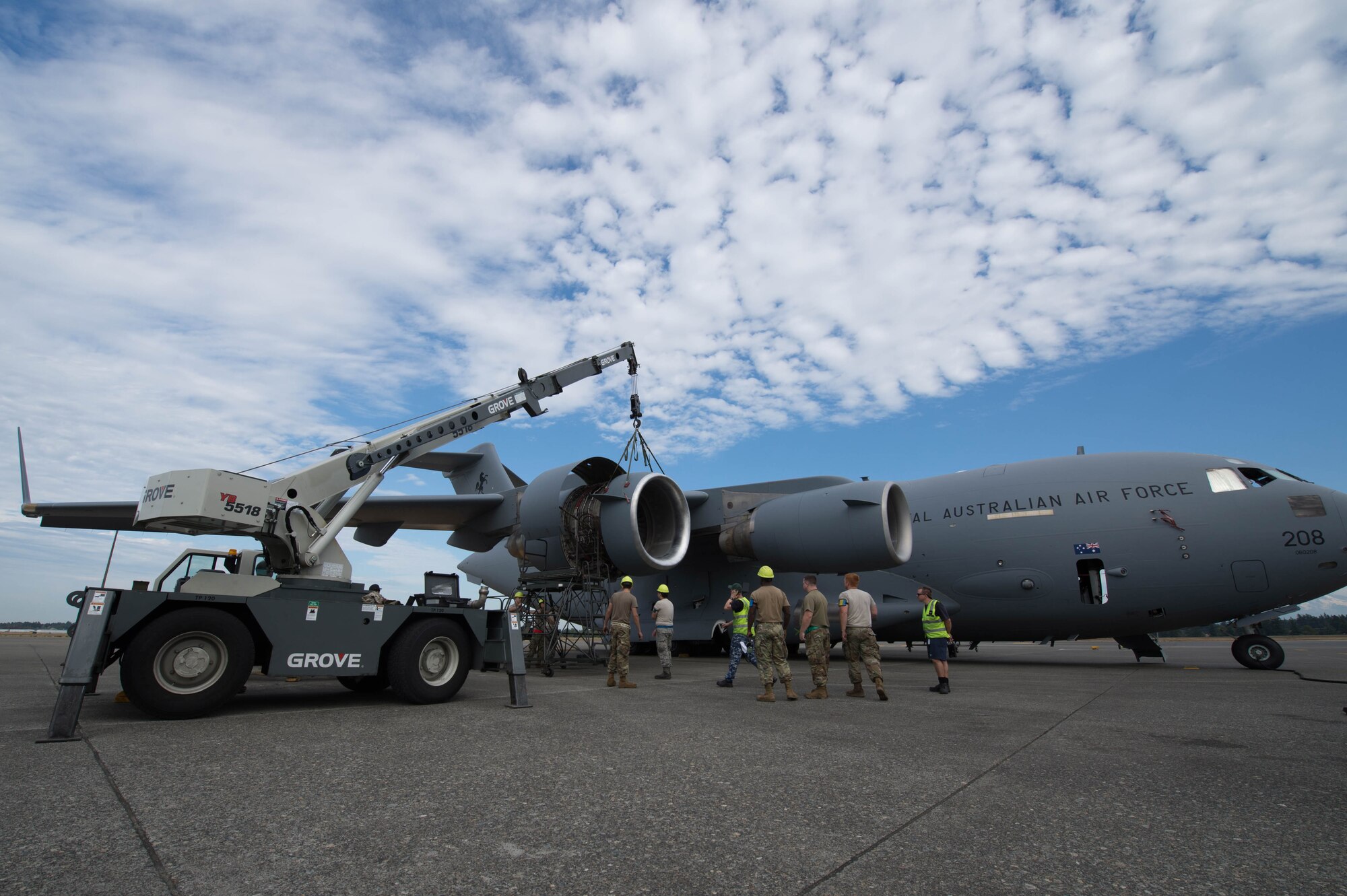 62nd Maintenance Squadron Airmen and Royal Australian Air Force Airmen work together to replace an engine ring cowl on an RAAF C-17 Globemaster III at Joint Base Lewis-McChord, Wash., Sept. 5, 2019.