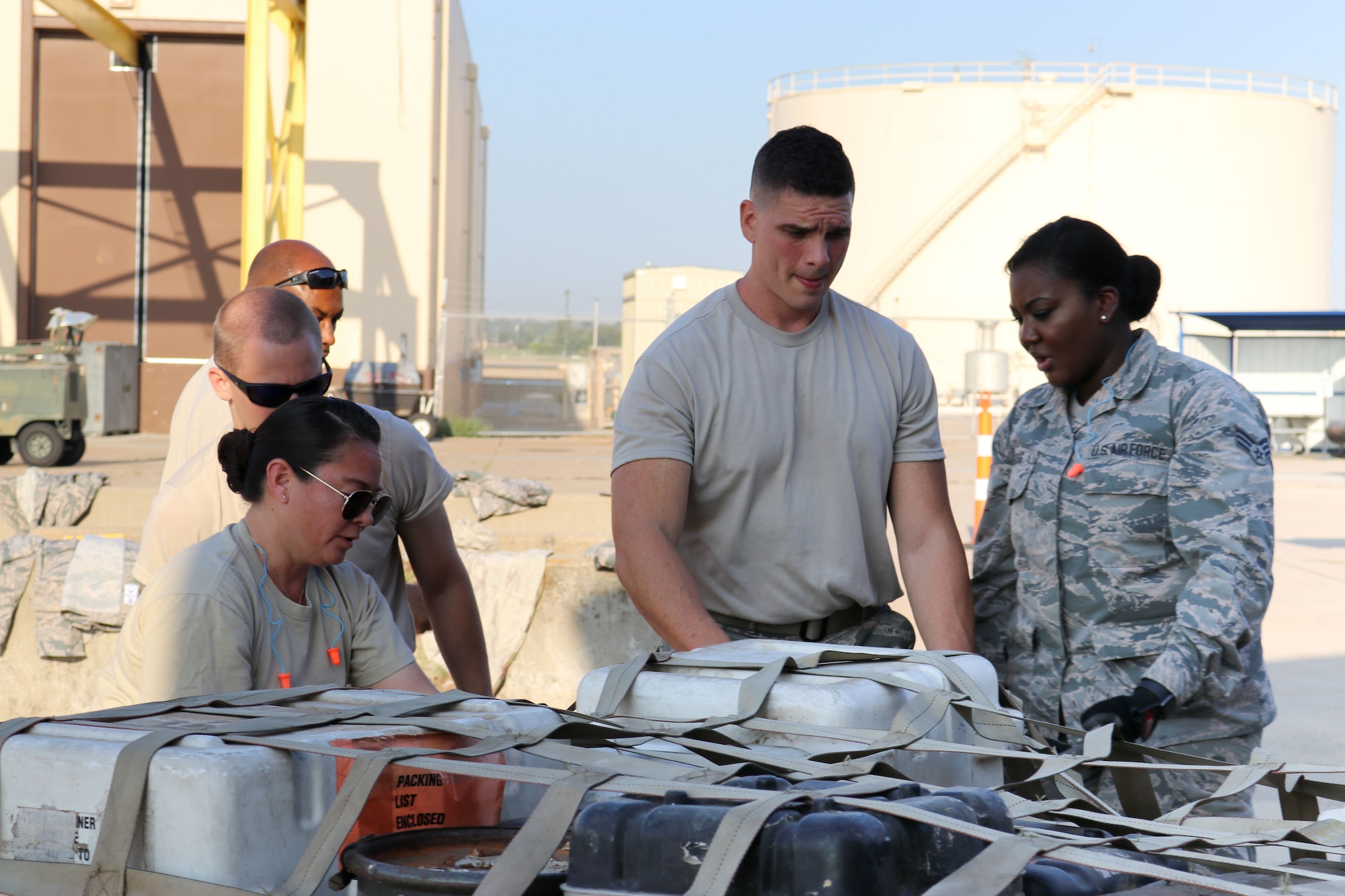 Members of the 72nd Aerial Port Squadron work as a team to secure cargo during a rodeo, Sept. 6, 2019, at Tinker Air Force Base, Oklahoma. The rodeo incorporated various jobs competed by aerial port in a fun and competitive atmosphere. (U.S. Air Force photo by Senior Airman Mary Begy)