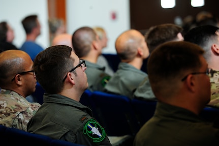 An audience of military members and civilians watch a video that provides a “snapshot” of what Andrew O’Brien, an Iraq War veteran, calls “This Crazy Journey” at Joint Base San Antonio-Randolph, Texas, Sept. 10, 2019. The Randolph mental health clinic invited O’Brien to share his experience as part of Suicide Awareness and Prevention Month activities.