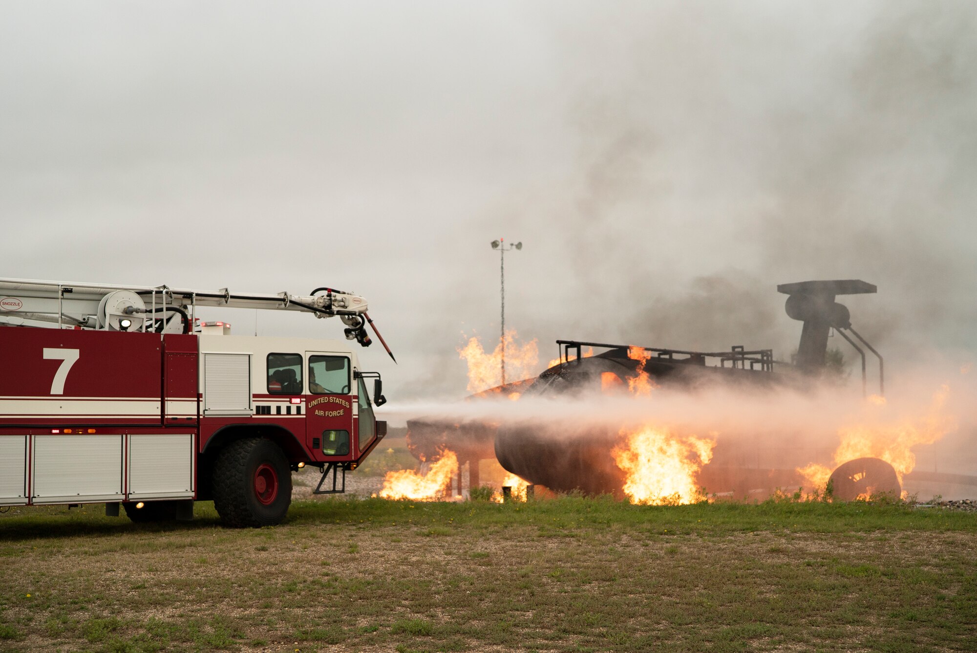 319th CES and Grand Forks International Airport firefighters joined to practice combating aircraft fires in an effort to train on readiness and maintain community relationships.