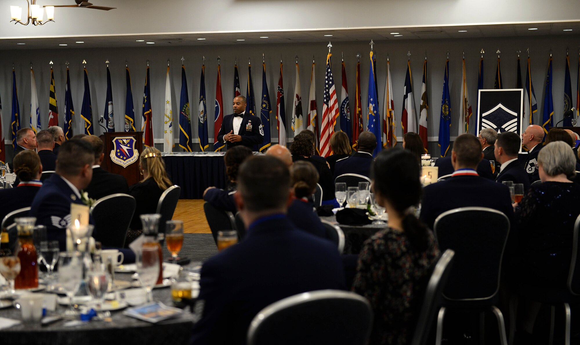 Chief Master Sgt. Jermaine Evans, Jeanne M. Holm Center for Officer Accessions and Citizen Deployment command chief master sergeant, from Maxwell Air Force Base, Ala., speaks to attendees during a Senior NCO Induction Ceremony Sept. 9, 2019, at the Club on Columbus AFB, Miss. As command chief master sergeant of the Holm Center, Evans spoke of the advice he gives to officers stepping into those leadership roles and how they can be more successful with their best tool in their units; the senior NCOs. (U.S. Air Force photo by Airman 1st Class Hannah Bean)