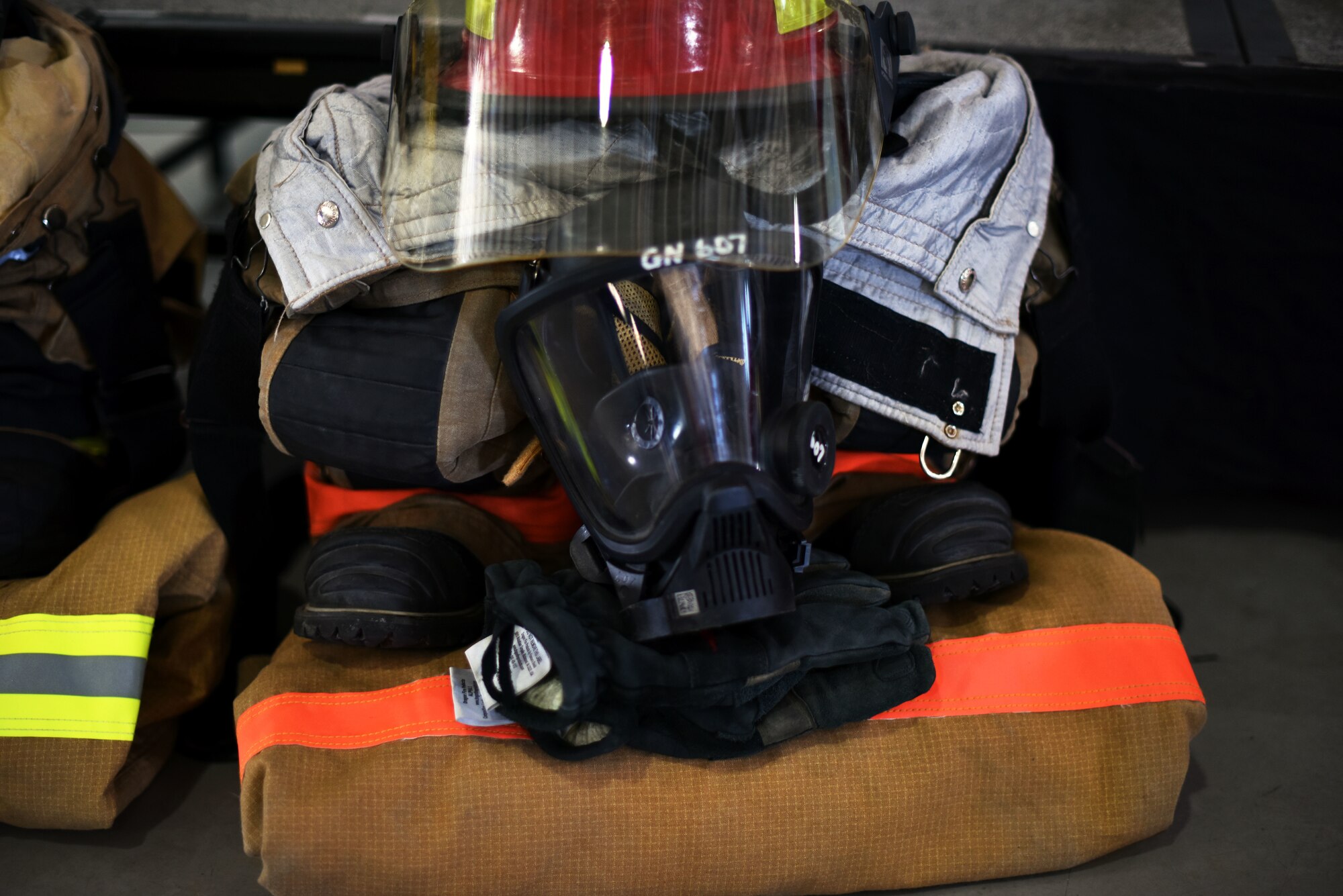 Firefighter equipment displayed at the Firefighter Remembrance Ceremony in the Department of Defense Louis F. Garland Fire Academy on Goodfellow Air Force Base, Texas, Sept. 11, 2019. The ceremony was held to honor those who paid the ultimate price during the fall of the twin towers, and also highlighted the 343 firefighters who gave their lives while helping others. (U.S. Air Force photo by Senior Airman Seraiah Wolf/Released)
