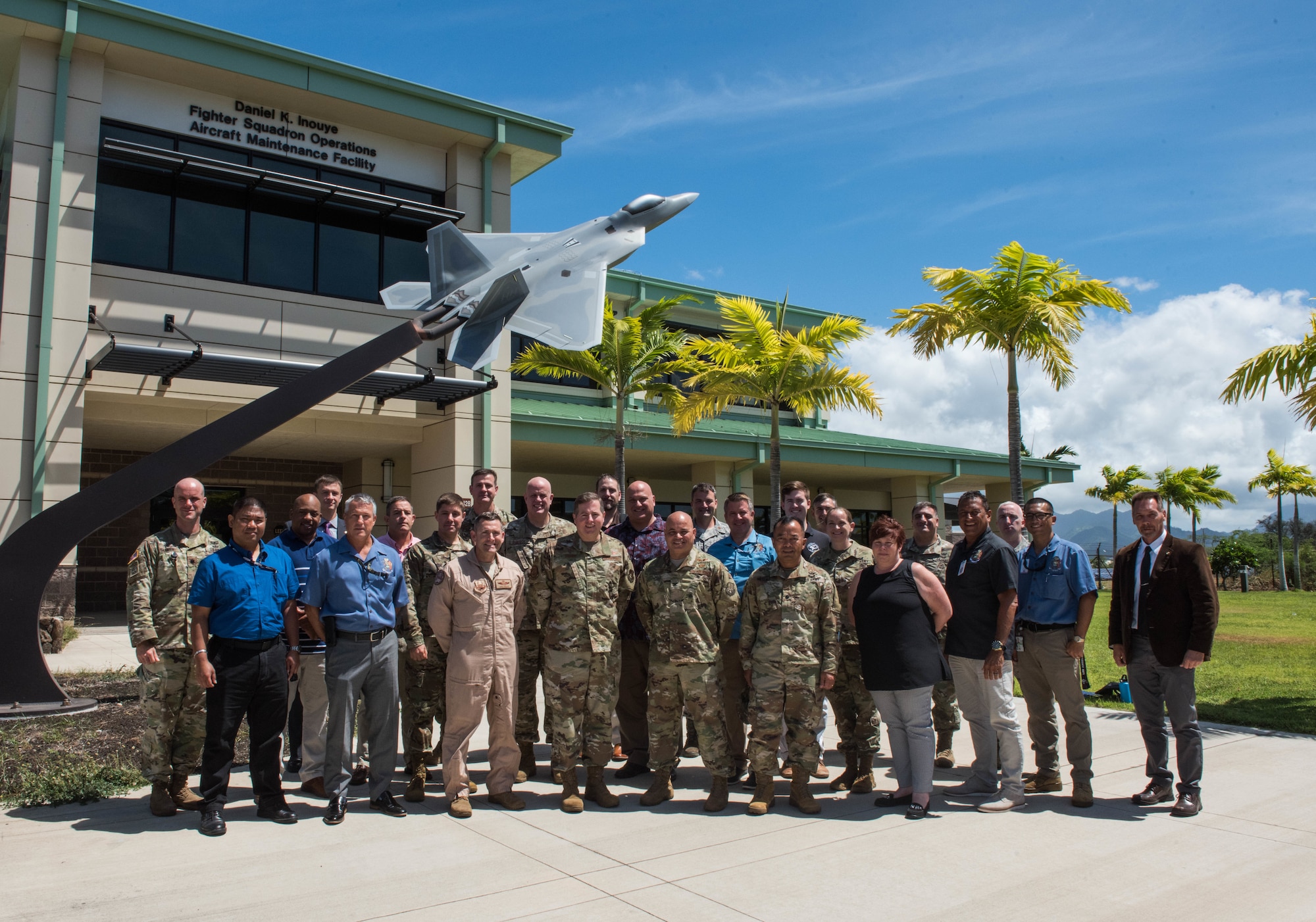 Participants of the Integrated Air and Missile Defense Center summit pose in front of the Hawaii Air National Guard Headquarters building, Joint Base Pearl Harbor-Hickam, Hawaii, Sept. 10, 2019. The purpose of the event – in its fifth iteration – is to provide a forum to exchange information, share lessons learned and best practices across the three Integrated Air and Missile Defense Centers. During the three-day conference, 30 participants received briefings on regional and global threats, emerging U.S. integrated air and missile defense capabilities, and were updated by the different Integrated Air and Missile Defense Centers around the globe. (U.S. Air Force photo by Staff Sgt. Hailey Haux)