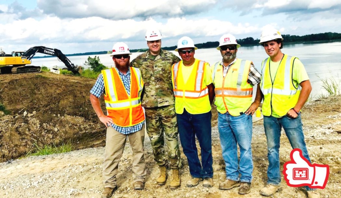 Group poses at Mound City jobsite